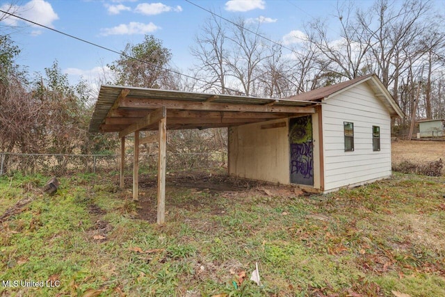 view of outbuilding with a carport