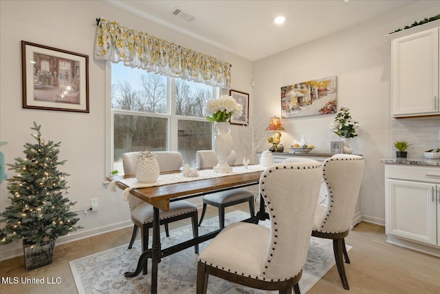 dining room featuring light hardwood / wood-style flooring