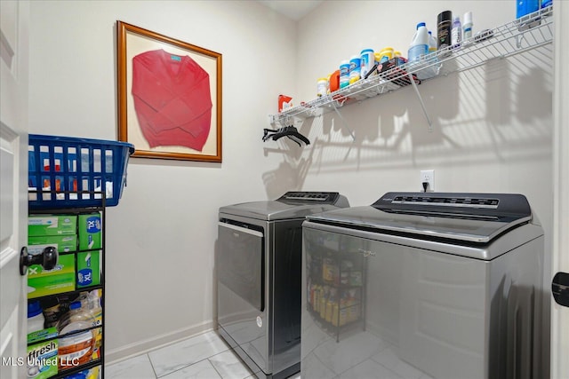 laundry area featuring washing machine and clothes dryer