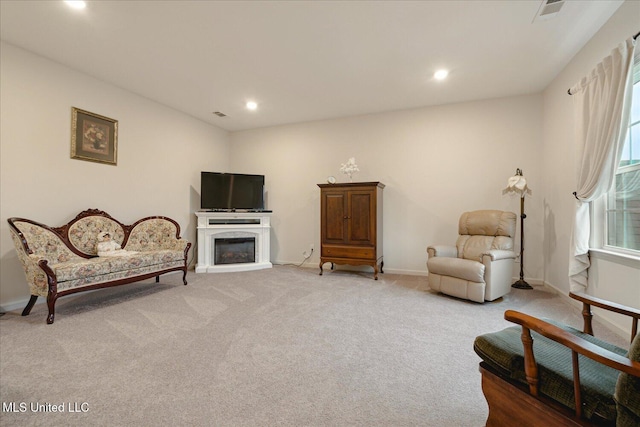 living area featuring carpet