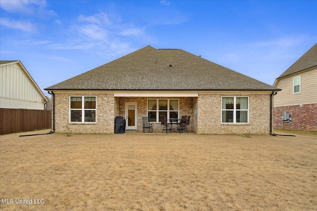 rear view of property featuring a patio area