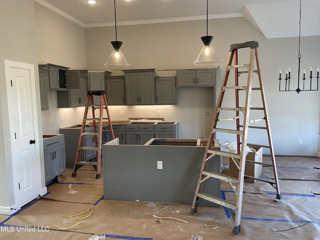 kitchen with a chandelier, ornamental molding, decorative light fixtures, and gray cabinetry