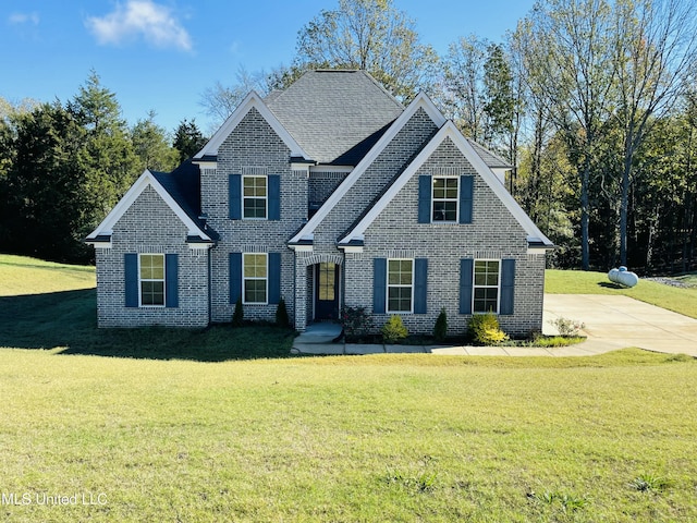 188 E Byhalia Creek Farms Rd, Byhalia, MS 38611 - traditional home with a front lawn, brick siding, and a shingled roof