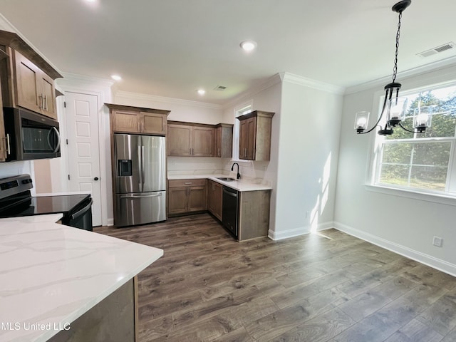 188 E Byhalia Creek Farms Rd, Byhalia, MS 38611 - kitchen featuring stainless steel appliances, baseboards, light stone countertops, a chandelier, and dark wood finished floors
