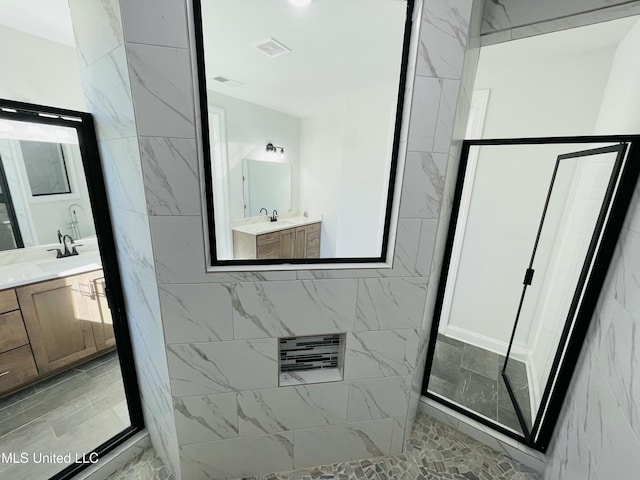 188 E Byhalia Creek Farms Rd, Byhalia, MS 38611 - full bathroom with a stall shower, vanity, and marble finish floors