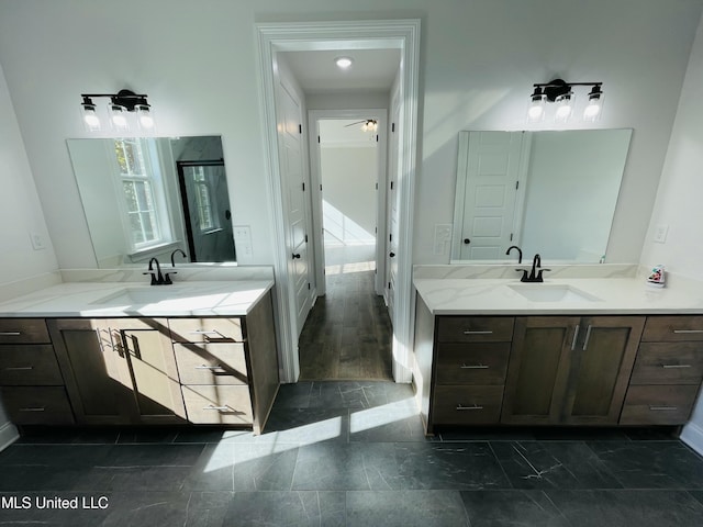 188 E Byhalia Creek Farms Rd, Byhalia, MS 38611 - full bathroom with two vanities, a ceiling fan, and baseboards
