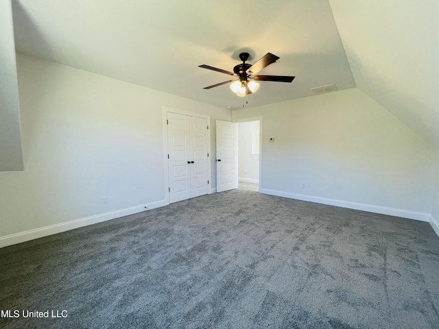 188 E Byhalia Creek Farms Rd, Byhalia, MS 38611 - unfurnished bedroom with dark colored carpet, baseboards, lofted ceiling, and a ceiling fan