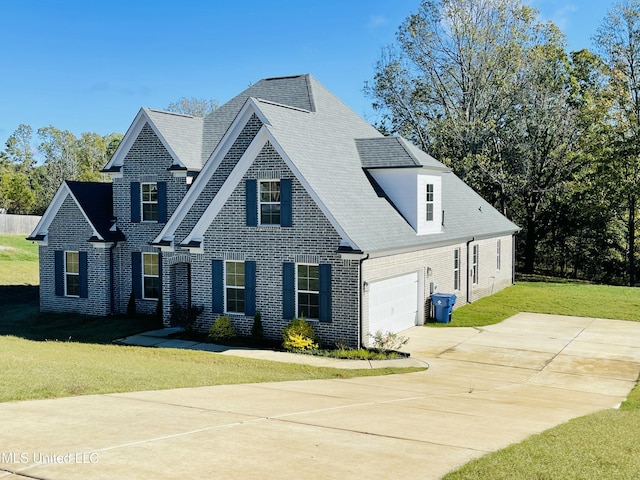 188 E Byhalia Creek Farms Rd, Byhalia, MS 38611 - traditional-style home with brick siding, an attached garage, a front lawn, concrete driveway, and roof with shingles