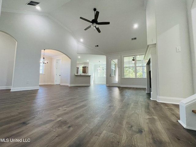 188 E Byhalia Creek Farms Rd, Byhalia, MS 38611 - unfurnished living room with ceiling fan, crown molding, arched walkways, high vaulted ceiling, and a chandelier