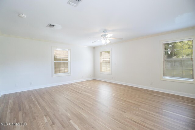 5100 Monroe Ave, Gulfport, MS 39507 - spare room featuring baseboards, visible vents, light wood-style floors, a ceiling fan, and crown molding