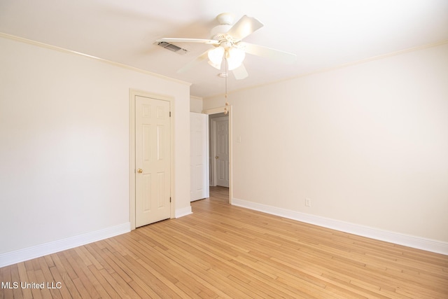 5100 Monroe Ave, Gulfport, MS 39507 - unfurnished room featuring visible vents, light wood-type flooring, crown molding, baseboards, and ceiling fan