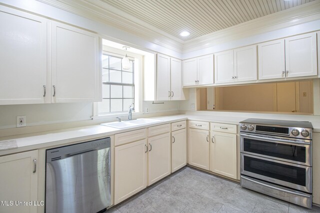 5100 Monroe Ave, Gulfport, MS 39507 - kitchen with a sink, appliances with stainless steel finishes, light countertops, white cabinets, and ornamental molding