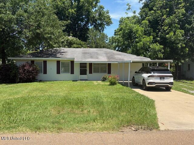 1108 W President Ave, Greenwood, MS 38930 - single story home featuring an attached carport, a front yard, and concrete driveway