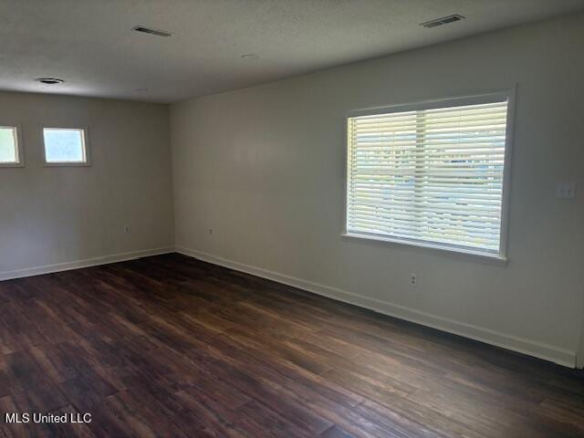 1108 W President Ave, Greenwood, MS 38930 - unfurnished room with dark wood-style flooring and baseboards