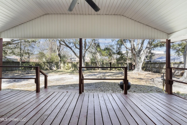 wooden deck with a ceiling fan and a fenced backyard