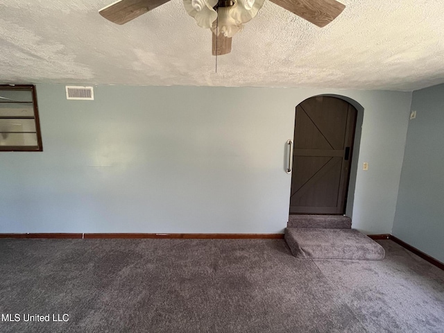 5020 Barrier Pl, Jackson, MS 39204 - unfurnished room with arched walkways, carpet flooring, a ceiling fan, and visible vents