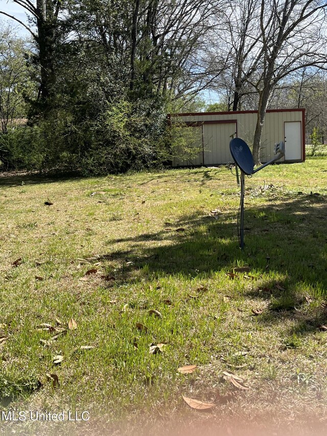5020 Barrier Pl, Jackson, MS 39204 - view of yard featuring an outbuilding and a pole building