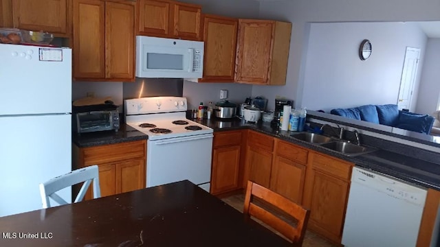 kitchen featuring sink and white appliances