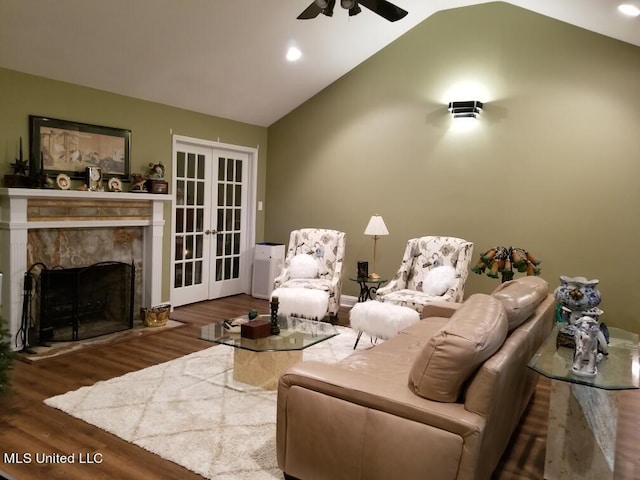 13456 John Clark Rd, Gulfport, MS 39503 - living room with ceiling fan, wood finished floors, french doors, vaulted ceiling, and a fireplace
