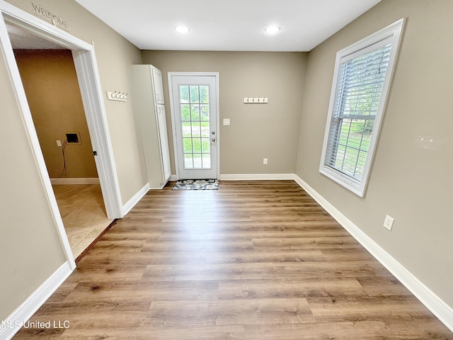 13456 John Clark Rd, Gulfport, MS 39503 - doorway to outside with light wood finished floors, baseboards, and recessed lighting