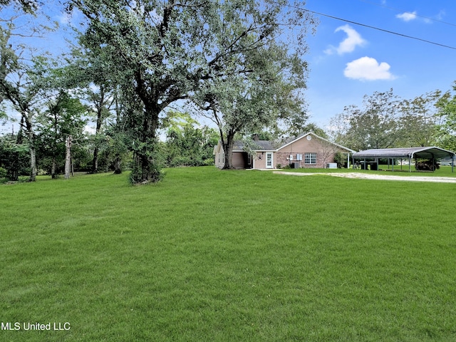 view of yard with a carport