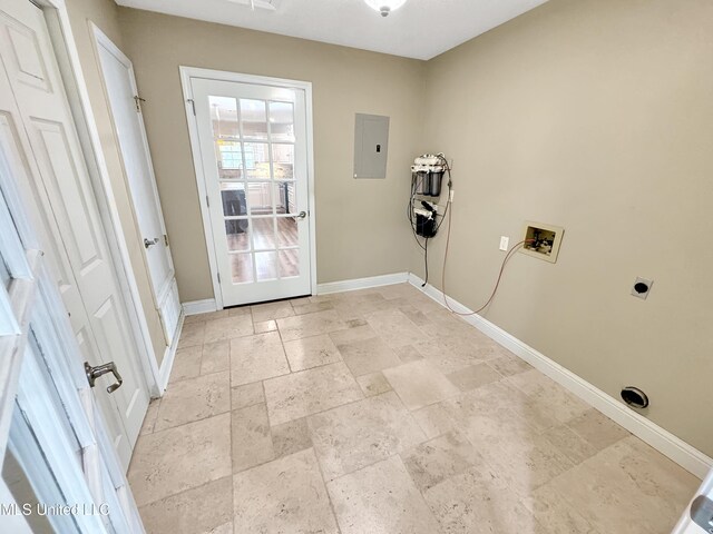 13456 John Clark Rd, Gulfport, MS 39503 - washroom featuring electric panel, washer hookup, stone tile flooring, baseboards, and hookup for an electric dryer