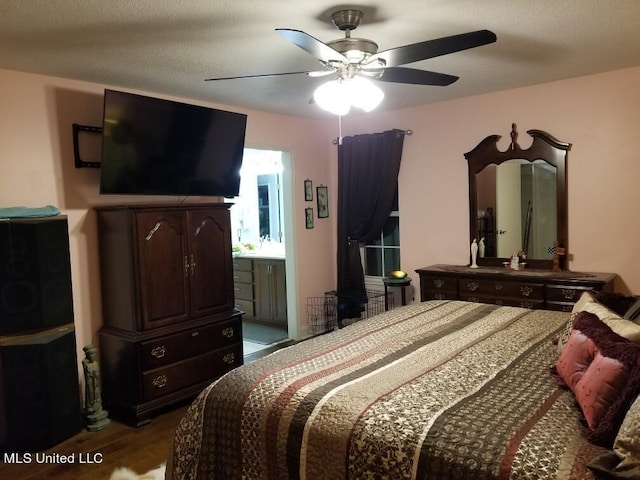 13456 John Clark Rd, Gulfport, MS 39503 - bedroom with ceiling fan, wood finished floors, and ensuite bathroom