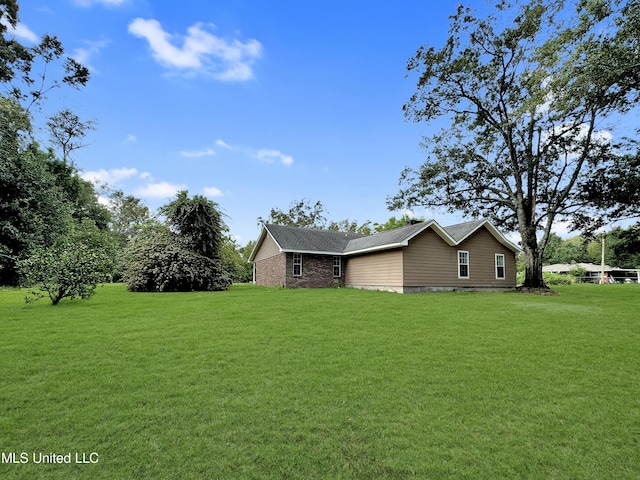 13456 John Clark Rd, Gulfport, MS 39503 - view of home's exterior featuring a lawn