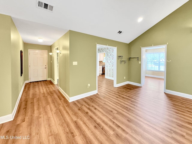 13456 John Clark Rd, Gulfport, MS 39503 - corridor with baseboards, light wood-style floors, and lofted ceiling