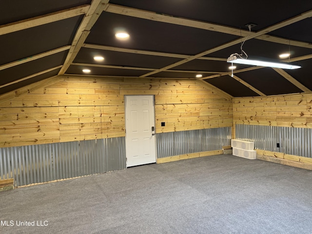 additional living space with wooden walls, recessed lighting, and carpet