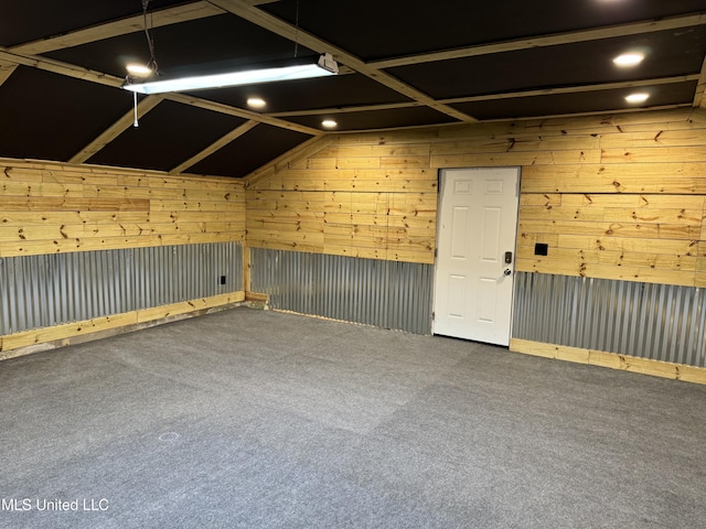 empty room with recessed lighting, carpet, and wood walls