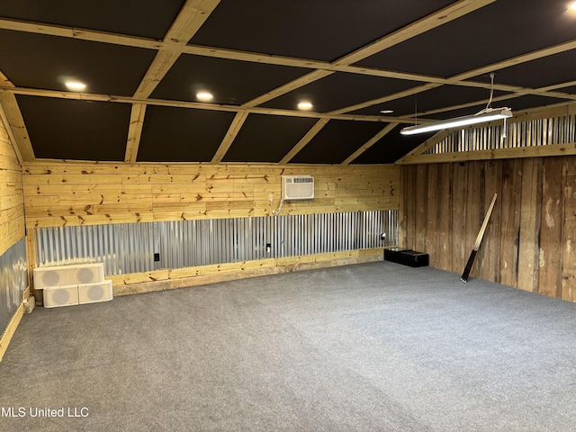 interior space with wood walls, a wall unit AC, and carpet