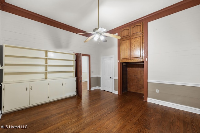unfurnished living room with baseboards, dark wood finished floors, and ceiling fan