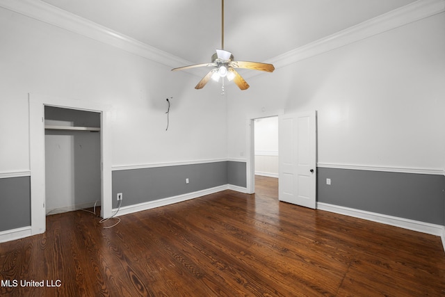unfurnished bedroom with a closet, ornamental molding, baseboards, and wood finished floors
