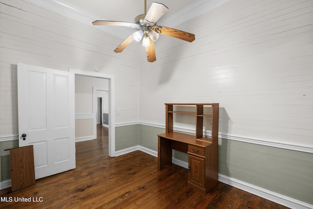 interior space with crown molding, a ceiling fan, and dark wood finished floors