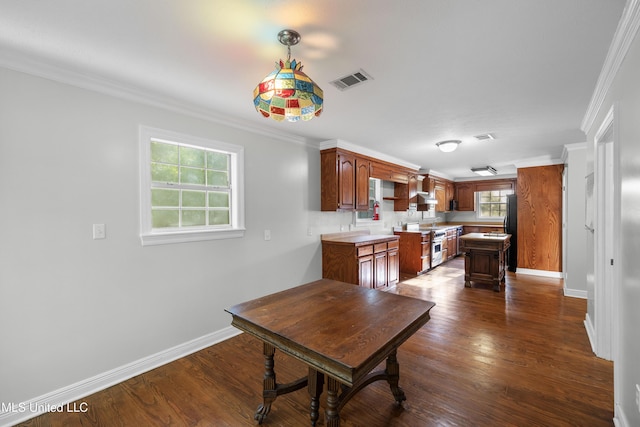dining area featuring baseboards, dark wood finished floors, and visible vents