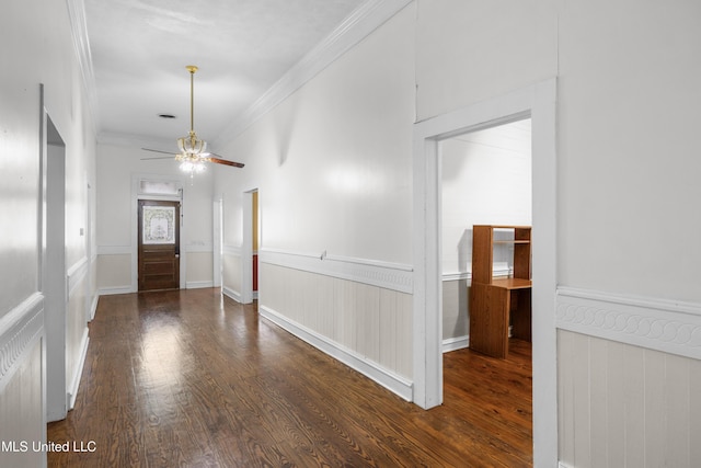 foyer featuring crown molding, a wainscoted wall, ceiling fan, and wood finished floors