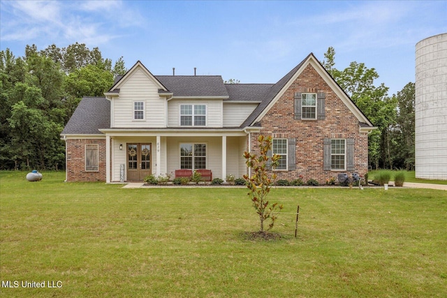 619 Centerline Roper Loop, Byhalia, MS 38611 - view of front of property featuring a front yard, brick siding, french doors, and a shingled roof