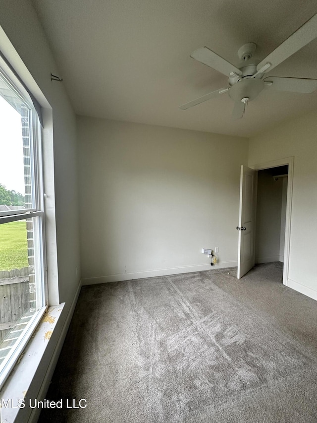 8 Shade Tree Dr, Carriere, MS 39426 - unfurnished bedroom with carpet flooring, baseboards, and ceiling fan