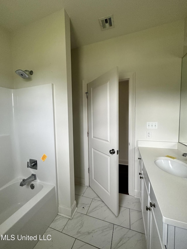 8 Shade Tree Dr, Carriere, MS 39426 - bathroom featuring marble finish flooring, vanity, baseboards, and bathtub / shower combination