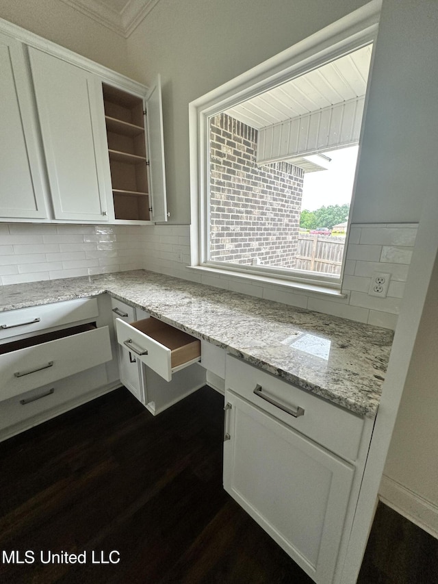 8 Shade Tree Dr, Carriere, MS 39426 - kitchen with open shelves, decorative backsplash, white cabinetry, dark wood finished floors, and ornamental molding