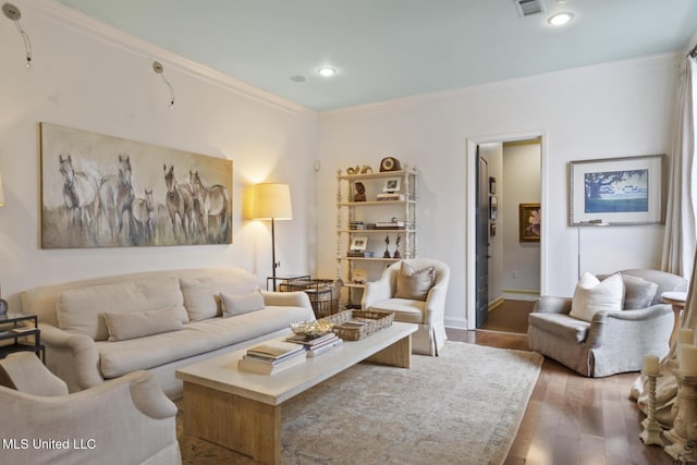 living room with ornamental molding and hardwood / wood-style floors