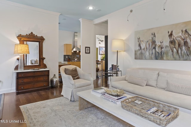 living room with dark hardwood / wood-style flooring and crown molding