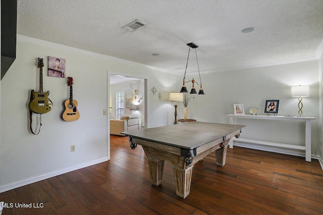 recreation room featuring dark wood-type flooring, crown molding, a textured ceiling, and pool table