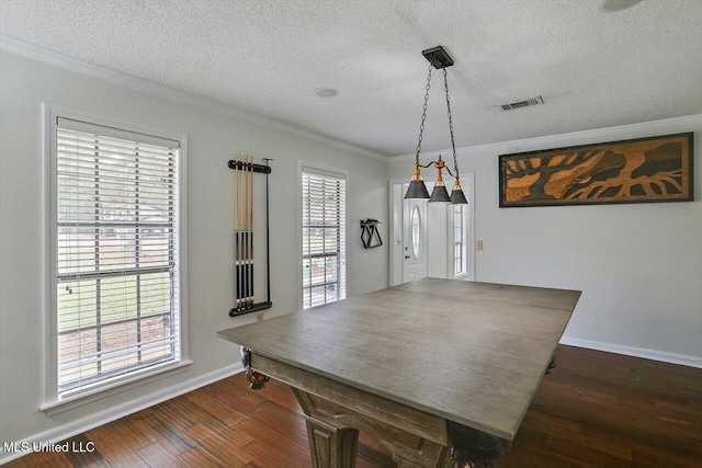 dining area with crown molding, a healthy amount of sunlight, a textured ceiling, and dark hardwood / wood-style floors