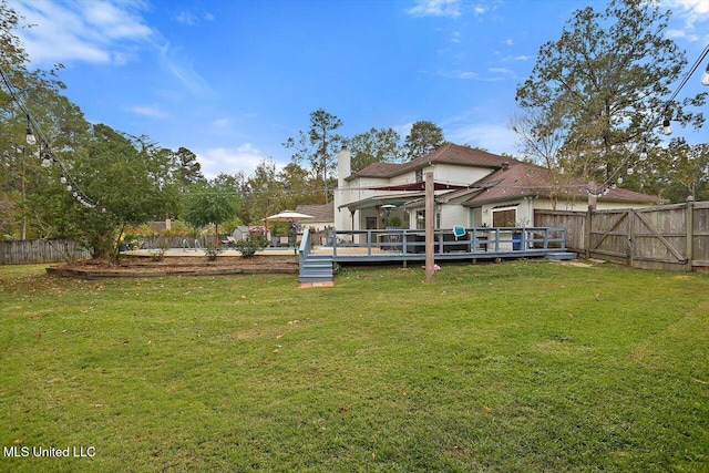 view of yard featuring a wooden deck