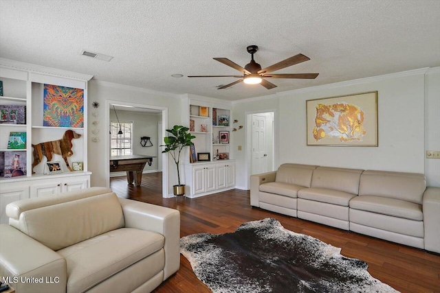 living room featuring pool table, ceiling fan, a textured ceiling, ornamental molding, and dark hardwood / wood-style floors