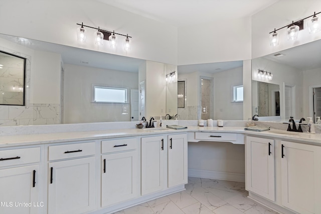 bathroom featuring vanity and a shower