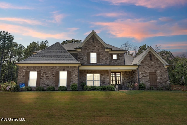 view of front of property with a yard