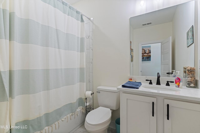 full bathroom with vanity, shower / bath combo with shower curtain, and toilet